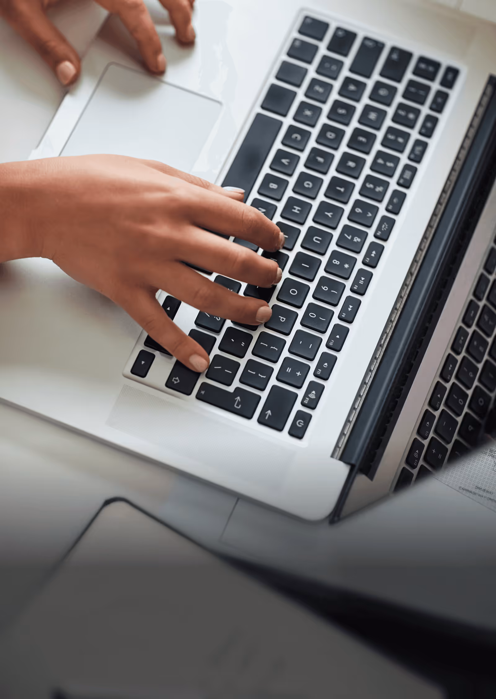 photo of someone typing on a keyboard