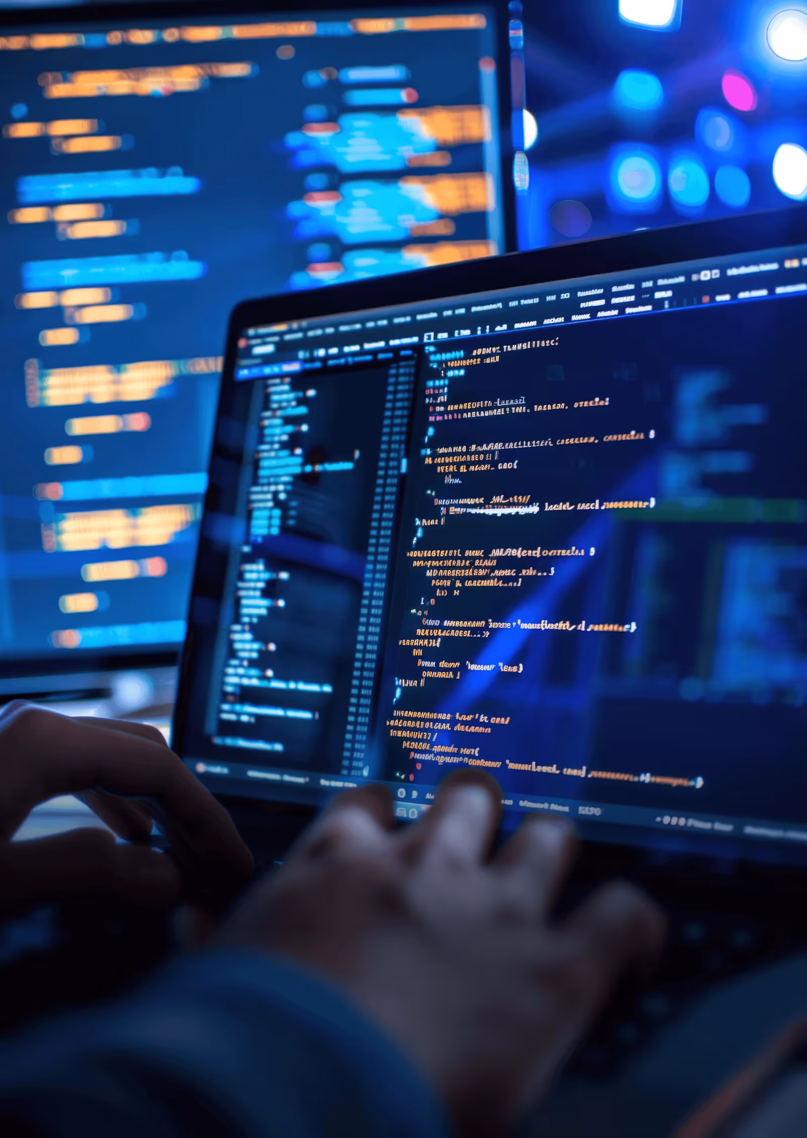 photo of a laptop with some website development code