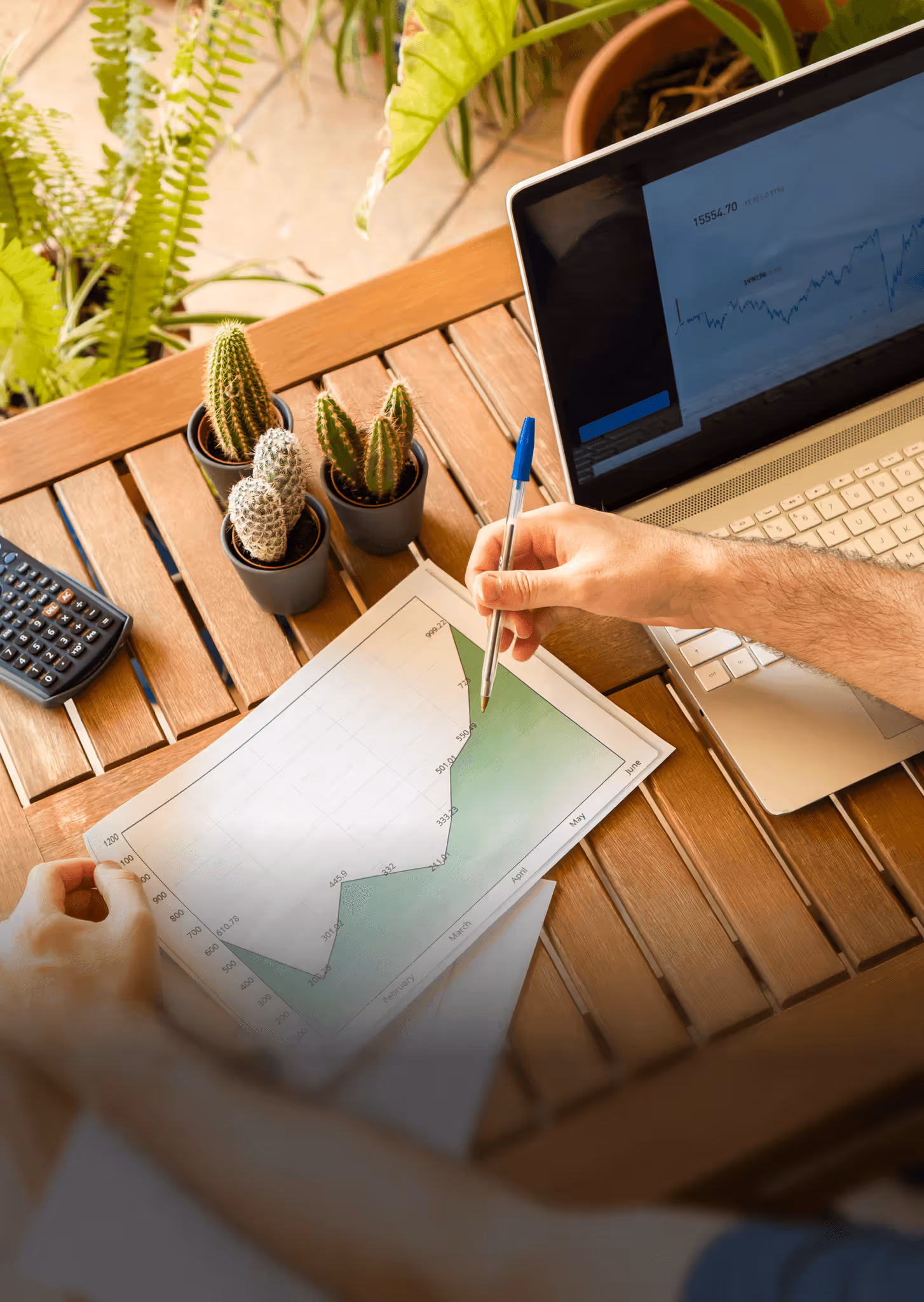 photo of someone drawing on a graph showing growth